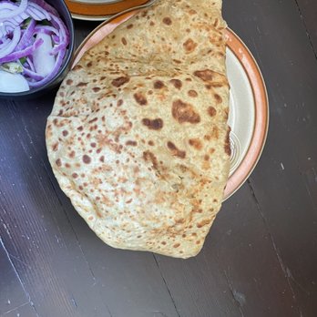 Punjabi Dhaba - Size of the parontha folded in half (this is a normal size plate) - Indian Near Me - Fresno, California Punjabi Dhaba - Size of the parontha folded in half (this is a normal size plate) - Indian Near Me - Fresno, California