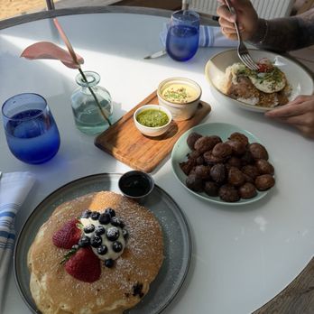 Hau Tree - calamansi pancakes, side of potato's, loco moco - Seafood Near Me - Honolulu, Hawaii
