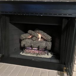 Fireplace cleaned, painted with new logs and burner Fireplace cleaned, painted with new logs and burner