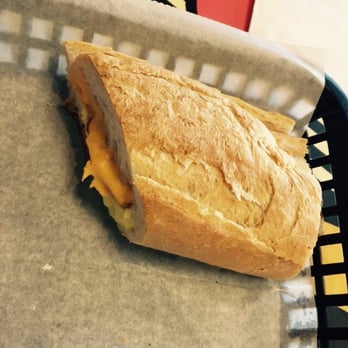 Mity Nice Cafe - Just one half of my ECB (egg bacon and cheese) on Cuban bread. - Breakfast & Brunch Near Me - Clearwater, Florida Mity Nice Cafe - Just one half of my ECB (egg bacon and cheese) on Cuban bread. - Breakfast & Brunch Near Me - Clearwater, Florida