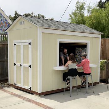 Real Sheds - a man and a woman sitting at a bar - General Contractors Near Me Real Sheds - a man and a woman sitting at a bar - General Contractors Near Me