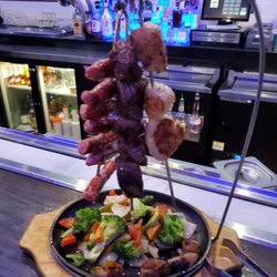 The Dog House Bar & Grill - Marinated steak tips, spicy pork sausage, scallops and grilled veggie! Soooooo yummy!!