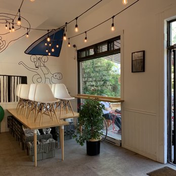 Racer Cafe - a dining room with a mural on the wall - Themed Cafes Near Me - Montreal, Quebec Racer Cafe - a dining room with a mural on the wall - Themed Cafes Near Me - Montreal, Quebec