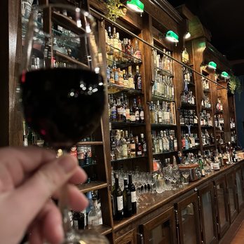 Thelma Carol Wine - a hand holding a glass of wine - Wine Bars Near Me - Milwaukee, Wisconsin Thelma Carol Wine - a hand holding a glass of wine - Wine Bars Near Me - Milwaukee, Wisconsin