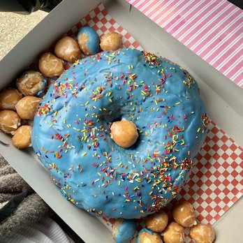 World's Fare Donuts - This donut is twice the size of my face!!! Priced at $25 and needs to be ordered at least a day in advance. - Donuts Near Me - Hayward, California World's Fare Donuts - This donut is twice the size of my face!!! Priced at $25 and needs to be ordered at least a day in advance. - Donuts Near Me - Hayward, California