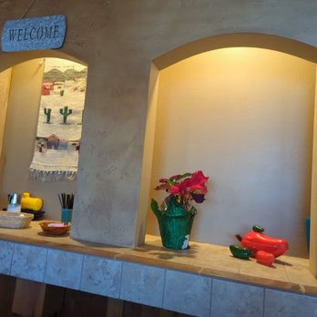 Santa Fe Coffee & Burrito - a shelf with flowers - Mexican Near Me - Longmont, Colorado
