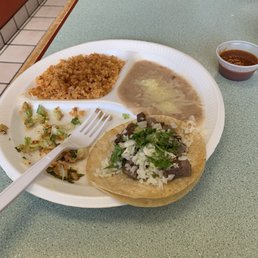 Taco combination plate with rice and beans! One lengua taco and one chicken taco. Taco combination plate with rice and beans! One lengua taco and one chicken taco.