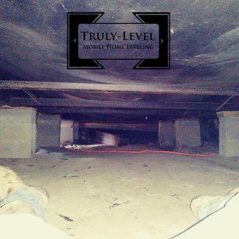 Truly level - Examining under mobile home for exact estimate. - Mobile Home Repair Near Me