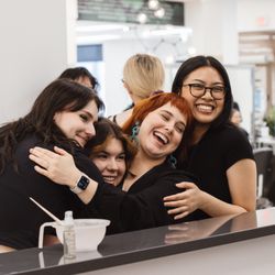 Aveda Institute & Academy Salon - Close knit group of students