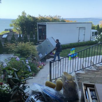 Washingtons Movers - Taking the refrigerator down 15 steps to their truck! Such a hard job! - Movers Near Me - Seattle, Washington