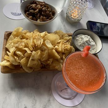 Drip Drop Cocktail Room - Light fair - chips and French onion dip and mixed nuts with the Doc of the Bae cocktail - Cocktail Bars Near Me - Grand Rapids, Michigan Drip Drop Cocktail Room - Light fair - chips and French onion dip and mixed nuts with the Doc of the Bae cocktail - Cocktail Bars Near Me - Grand Rapids, Michigan