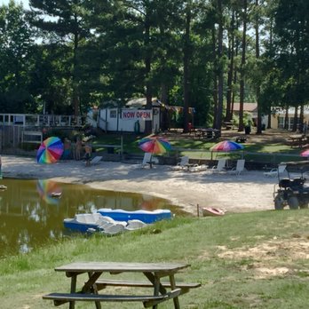 Emerald Lake Naturist Resort - View from our Lake House porch of the beach and front area of the campground. - Resorts Near Me - Porter, Texas