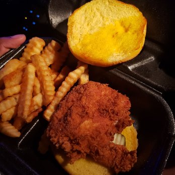 Zaxbys - This is the signature sandwich I received. No cheese,  bacon ,sauce. Nothing!!! Meat and bread. Pickles too. - Fast Food Near Me - Stockbridge, Georgia