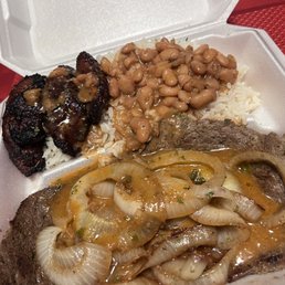 Onion Steak with white rice and beans and sweet plantains. Onion Steak with white rice and beans and sweet plantains.