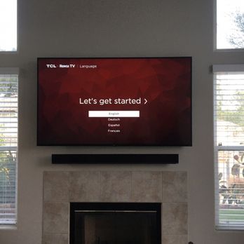 Connected Media Solutions - TV and soundbar mounted above fireplace - Home Theatre Installation Near Me Connected Media Solutions - TV and soundbar mounted above fireplace - Home Theatre Installation Near Me
