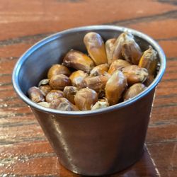 Inka Grill - A small dish with roasted corn kernels.