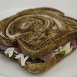 Array Cafe - Did someone say pastrami? Pastrami with spicy brown mustard, pickles and coleslaw on marble rye.