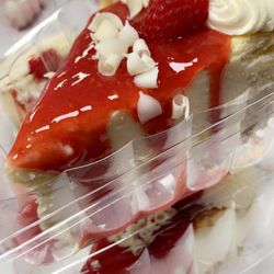 Kim's Kakes - White chocolate cheesecake w/raspberry drizzle