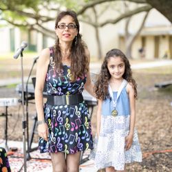 Miss Ruth's Piano School - Sarah with her piano medal at the Awards Ceremony of the "2021 Miss Ruth's Piano School's 1rst Outdoor Recital"
