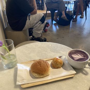 Varraco Coffee + Roasters - Lots going on here! From L to R that's an Adobo Pandesal, a Beef Empanada, and an Ube Latte. - Coffee & Tea Near Me - Palm Desert, California Varraco Coffee + Roasters - Lots going on here! From L to R that's an Adobo Pandesal, a Beef Empanada, and an Ube Latte. - Coffee & Tea Near Me - Palm Desert, California