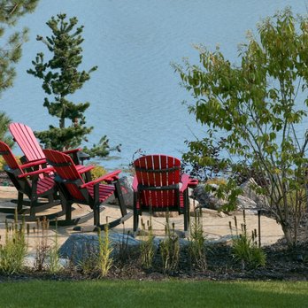 Carson Outdoor Living - two red adironder chairs overlooking a lake - Landscaping Near Me - Valley, Nebraska