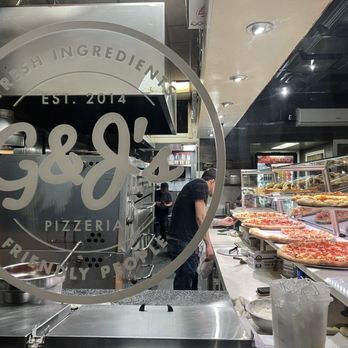 G&J's Pizzeria - The only signs the have are painted on the window. You won't see it coming, use your map app to find it. - Pizza Near Me - New York, New York