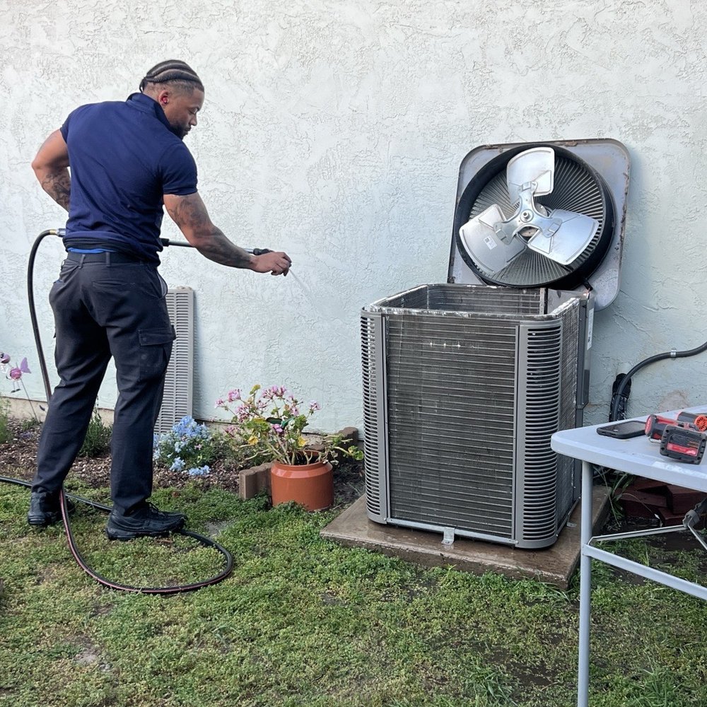 10 Summers Heating & Cooling - An HVAC technician cleaning and servicing an outdoor air conditioning unit during a maintenance tune-up. - Heating & Air Conditioning/HVAC Near Me - Sacramento, California 10 Summers Heating & Cooling - An HVAC technician cleaning and servicing an outdoor air conditioning unit during a maintenance tune-up. - Heating & Air Conditioning/HVAC Near Me - Sacramento, California