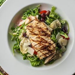 Peppery arugula with all-natural grilled chicken, cherry tomatoes, black olives, artichoke, and shaved parmesan.