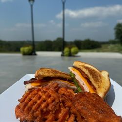 Osage View - turkey club with sweet potato fries with the view of our outdoor patio