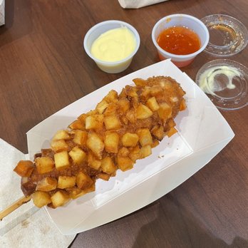 Oh K-Dog - Potato mozza dog with cheese mustard and sweet chili dipping sauces. - Korean Near Me - Tulsa, Oklahoma Oh K-Dog - Potato mozza dog with cheese mustard and sweet chili dipping sauces. - Korean Near Me - Tulsa, Oklahoma