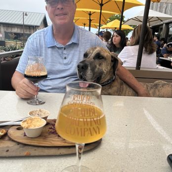 Malibu Brewing - Mike with his stout and Duke (the lap dog) - Breweries Near Me - Malibu, California Malibu Brewing - Mike with his stout and Duke (the lap dog) - Breweries Near Me - Malibu, California