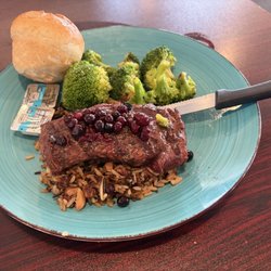 Two Sisters Cafe - Bison tenderloin with huckleberry sauce, wild rice with cranberries, steamed broccoli.
