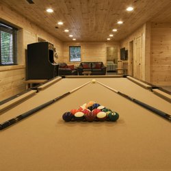 Hickory Hill Lodge - Pool table & arcade game in the lower level. It also includes a bathroom, 2 bedrooms and laundry room. Opens up to fire pit & hot tub.