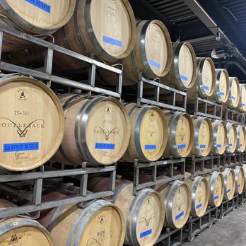 Doubleback Winery - barrels stacked on a rack - Wine Tasting Room Near Me - Walla Walla, Washington