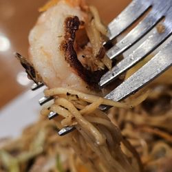 Wok n Roll Kitchen - Close-up of a fork with a shrimp from the Combo Lo Mein.