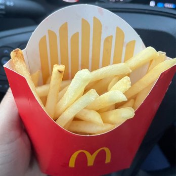 McDonald's - a hand holding a box of french fries - Burgers Near Me - Hazlet, New Jersey