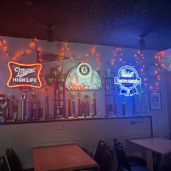 Round Corner Tavern - Neon signs and trophies. - Dive Bars Near Me - Sacramento, California Round Corner Tavern - Neon signs and trophies. - Dive Bars Near Me - Sacramento, California