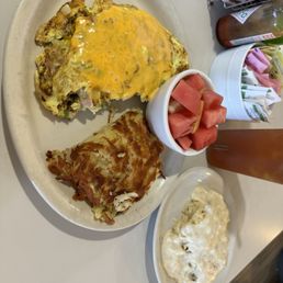 Denver omelet with biscuits and gravy with fruit cup Denver omelet with biscuits and gravy with fruit cup