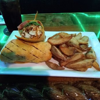 Thirsty Turtle SeaGrill - Chicken wrap and fries - Seafood Near Me - Juno Beach, Florida Thirsty Turtle SeaGrill - Chicken wrap and fries - Seafood Near Me - Juno Beach, Florida
