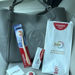 Warr Acres Dental Group - Goody bag with toothpaste, floss and toothbrush