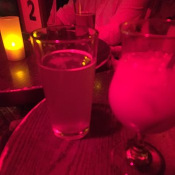 Lizard Lounge - two people sitting at a table with drinks - Music Venues Near Me - Cambridge, Massachusetts Lizard Lounge - two people sitting at a table with drinks - Music Venues Near Me - Cambridge, Massachusetts