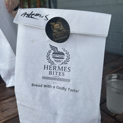 Hermes Bites - Each entree with side arrived in a take-out bag and was accompanied by a wooden plate.