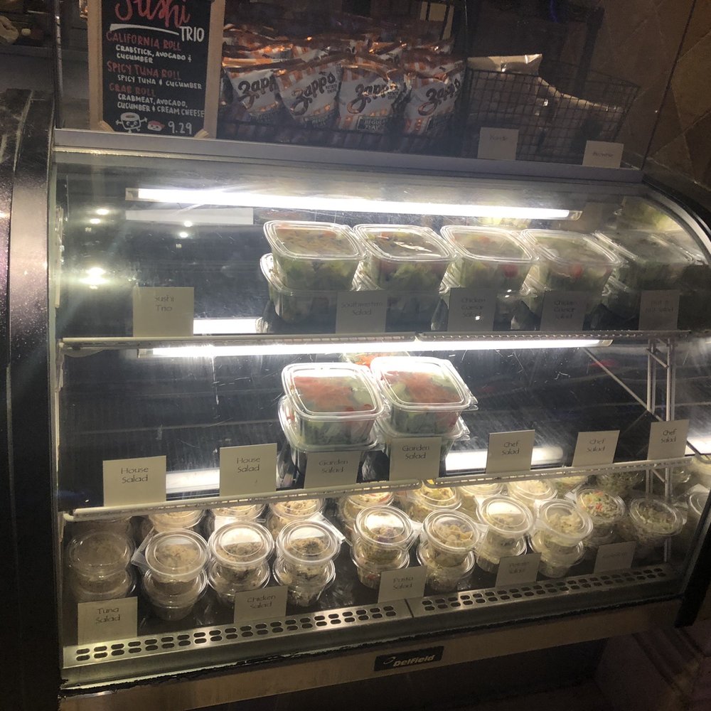 Snacks - a display case filled with various types of food - Sandwiches Near Me - Biloxi, Mississippi