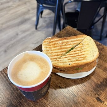 The Well Coffee House - oatmilk latte & grilled ham panini - Coffee & Tea Near Me - Boston, Massachusetts The Well Coffee House - oatmilk latte & grilled ham panini - Coffee & Tea Near Me - Boston, Massachusetts