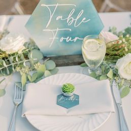 Table settings with floral garland Table settings with floral garland
