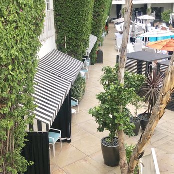 The Beverly Hilton - Cabanas with striped awnings - Hotels Near Me - Beverly Hills, California The Beverly Hilton - Cabanas with striped awnings - Hotels Near Me - Beverly Hills, California