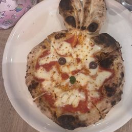 Bunny pizza... With little eyes, a little nose, and two pieces of cheese for its teeth the cutest Bunny pizza... With little eyes, a little nose, and two pieces of cheese for its teeth the cutest
