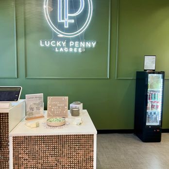 Lucky Penny Lagree - Front desk with grippy socks for sale and beverages - Pilates Near Me - Gilbert, Arizona