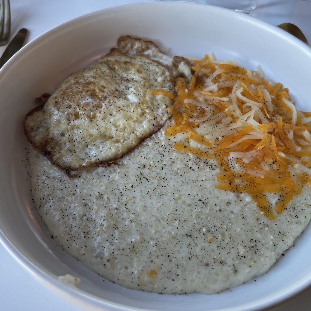 Breakfast Bowl with egg and cheese served over grits. Don't mind the pepper. I forgot to take the picture before adding! Breakfast Bowl with egg and cheese served over grits. Don't mind the pepper. I forgot to take the picture before adding!