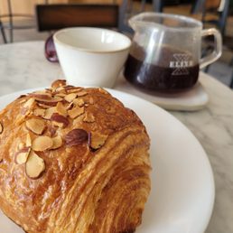 Almond croissant and a pour over La Palma Y El Tucan Almond croissant and a pour over La Palma Y El Tucan